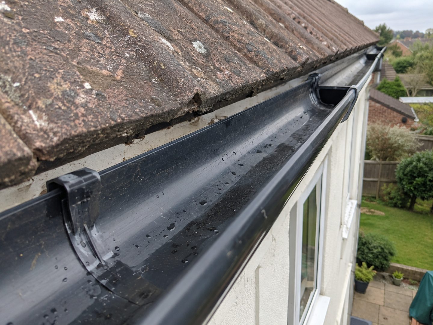 Guttering and roofline along the eaves of a tiled roof